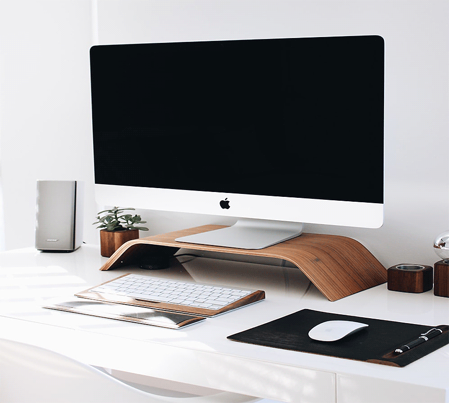 Apple desktop computer on a home office desk.