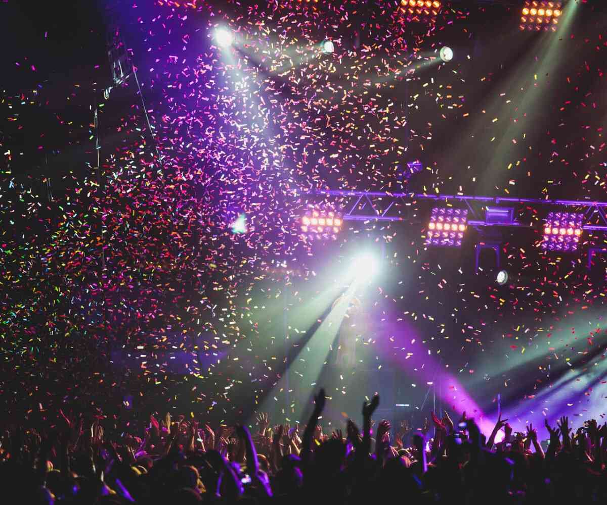 Confetti falling from the sky at a concert at the Little Caesars Arena.