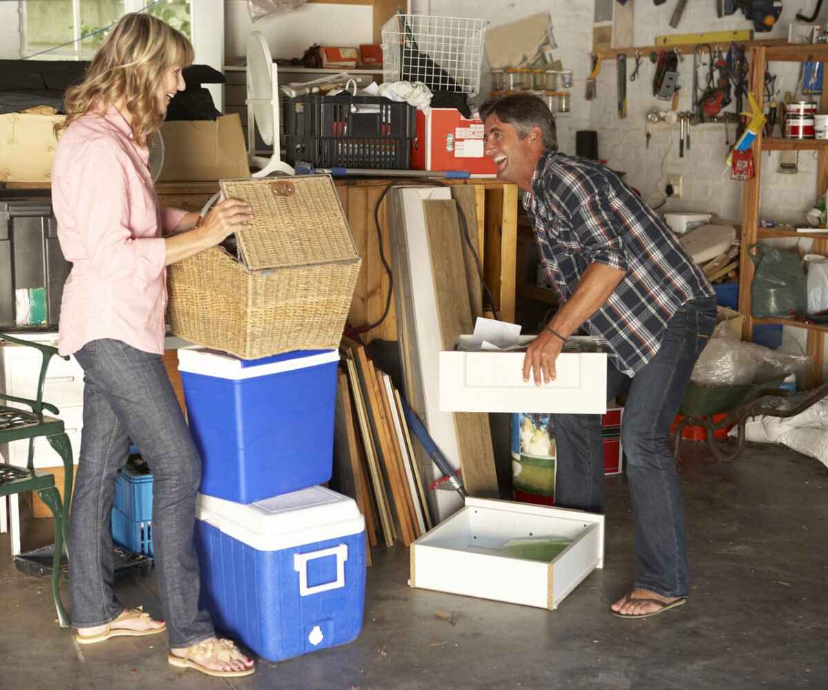 A couple organizing a garage for spring