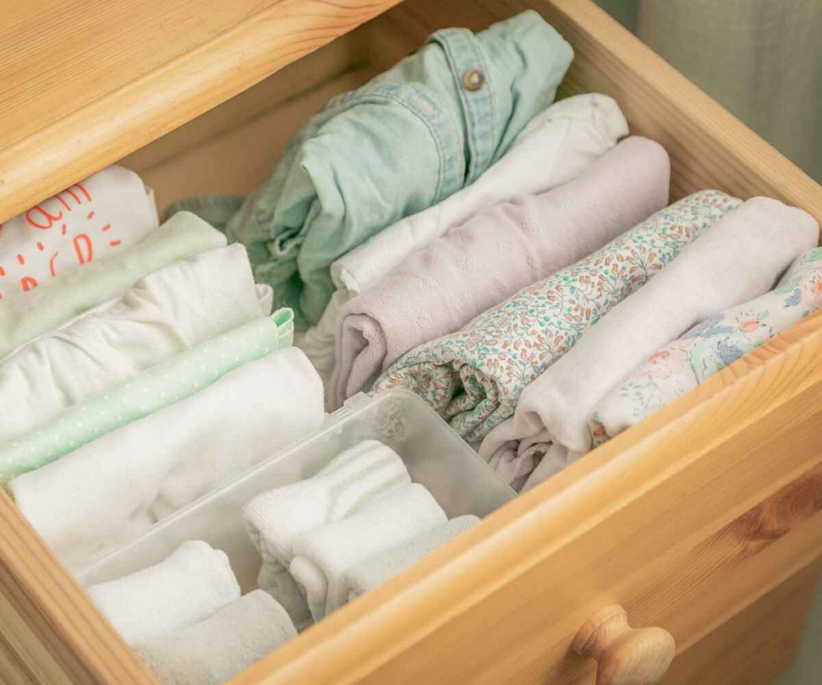 A drawer with neatly folded clothes.