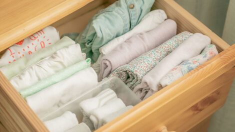 A drawer with neatly folded clothes.