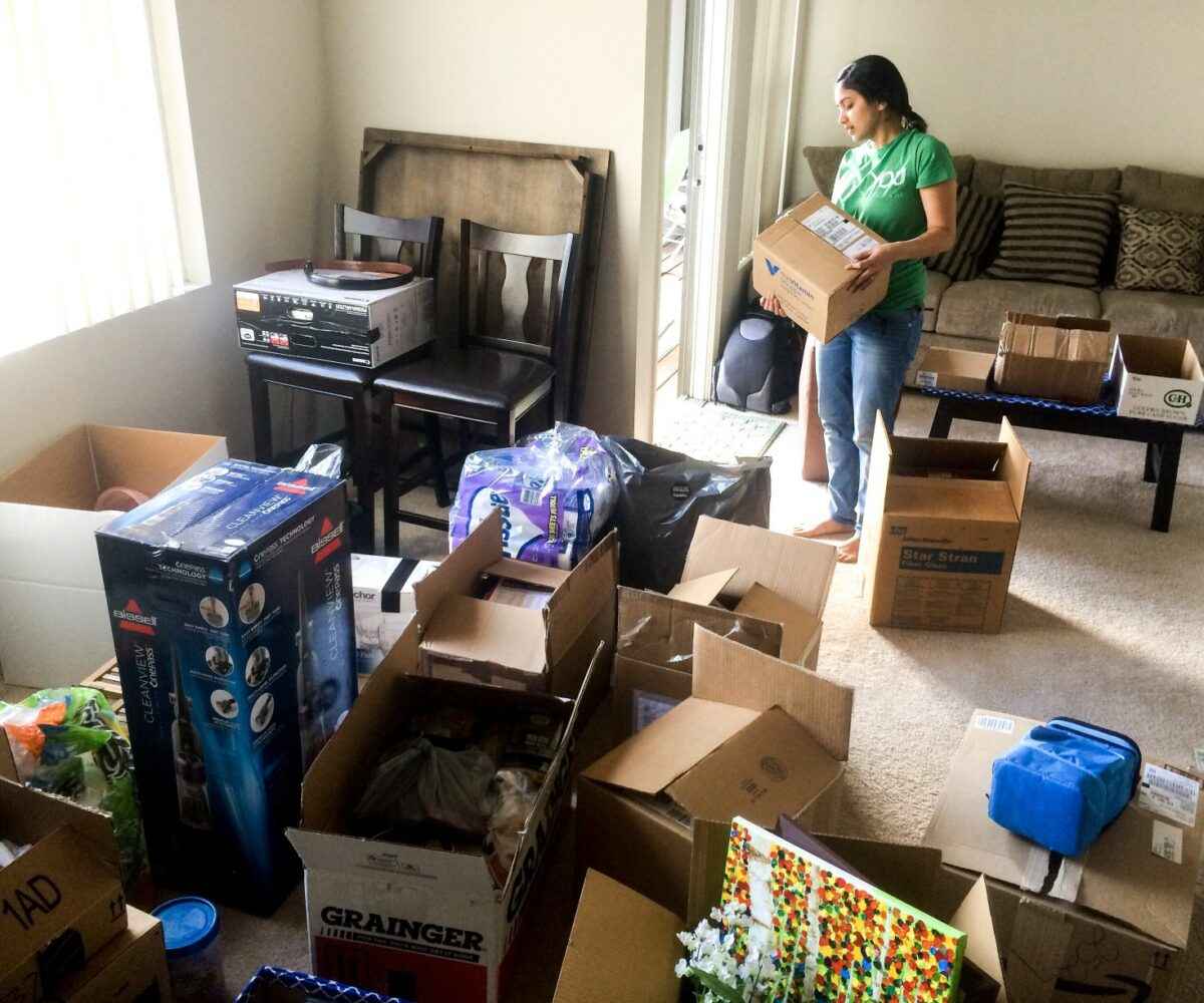 A woman packing boxes.