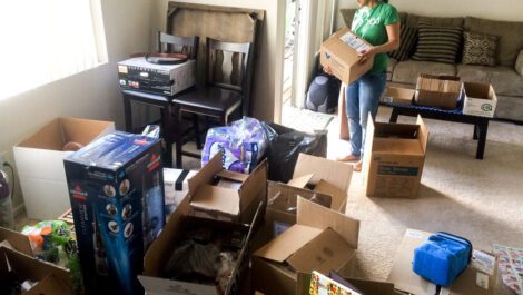 A woman packing boxes.