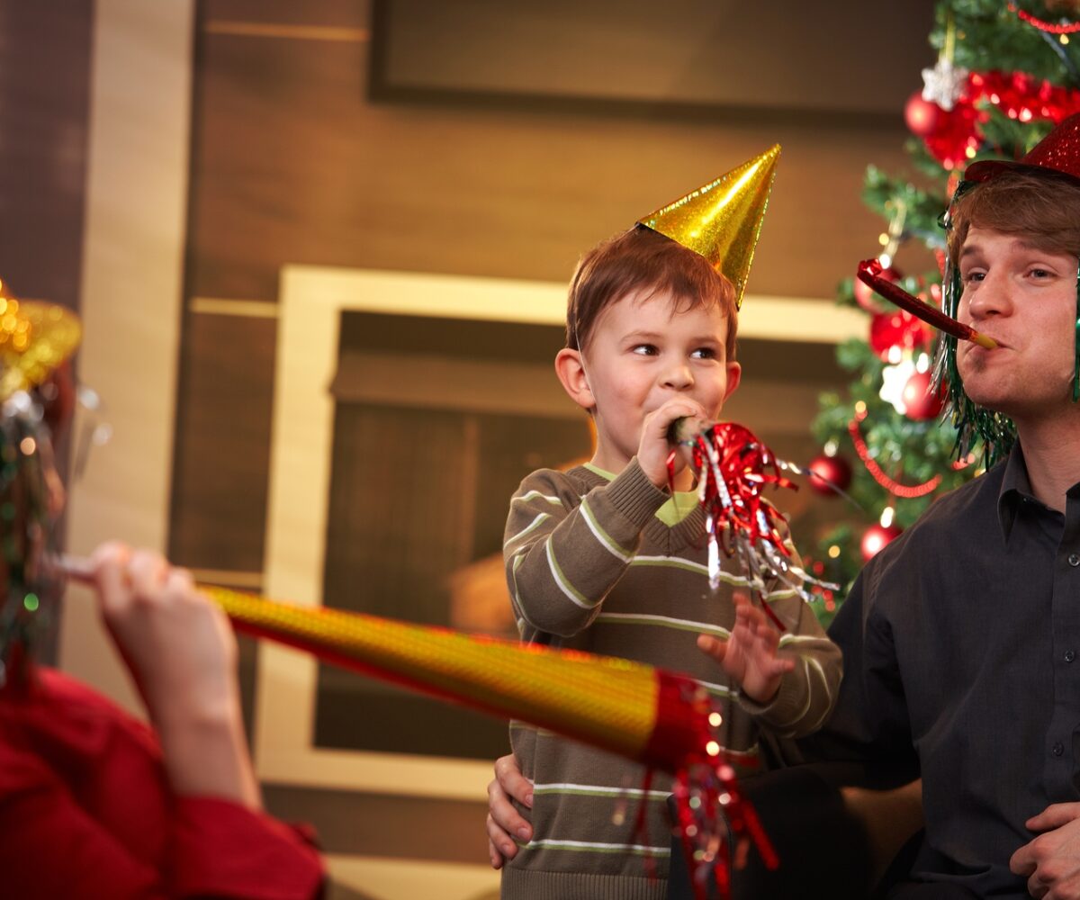 A family enjoying a New Year’s Eve celebration.