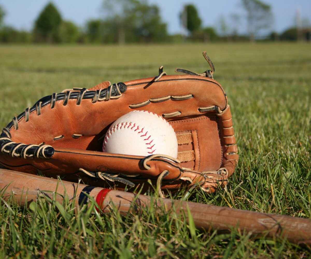 Baseball equipment on a grass field.