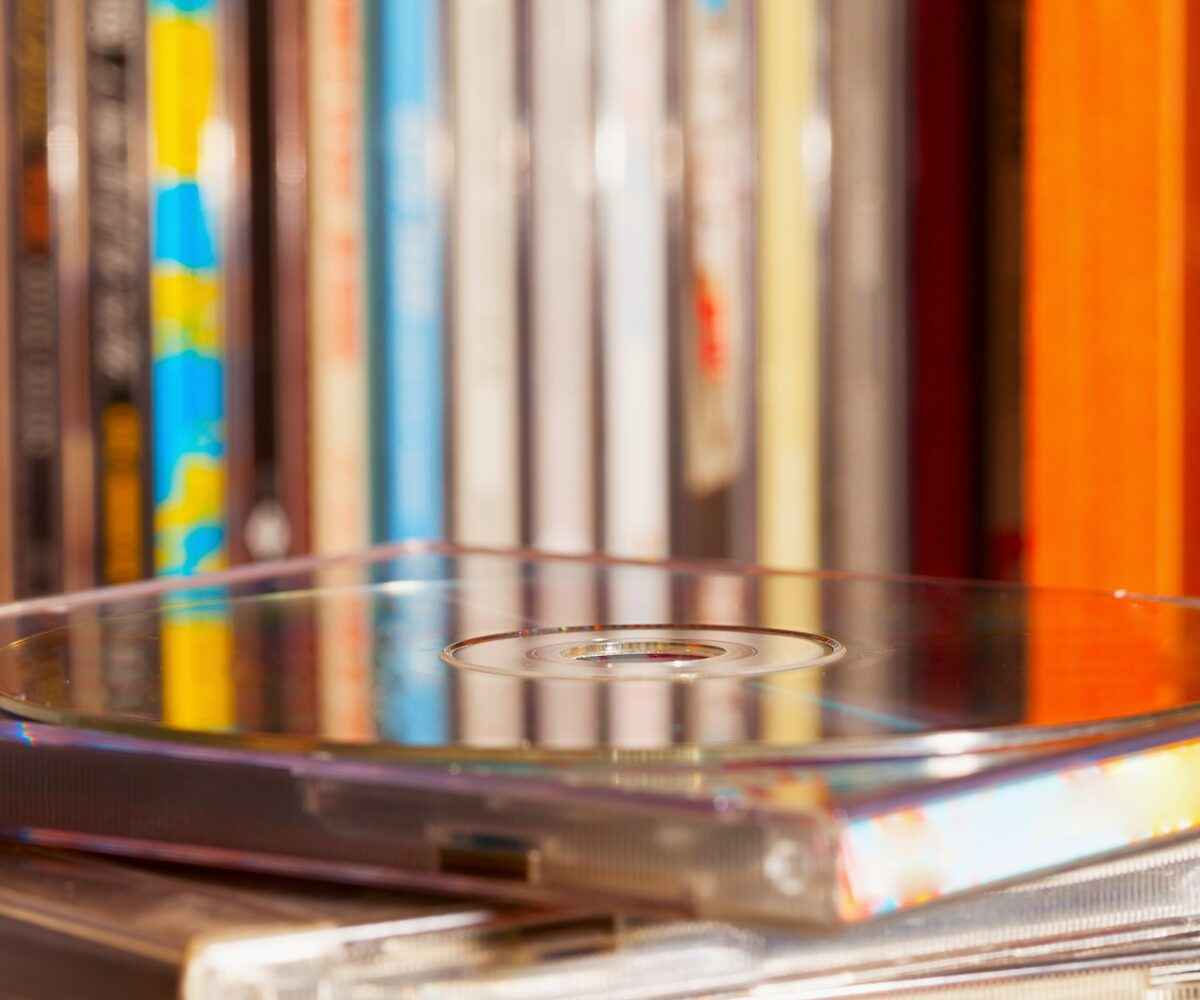 CD sitting on a stack of CD cases.