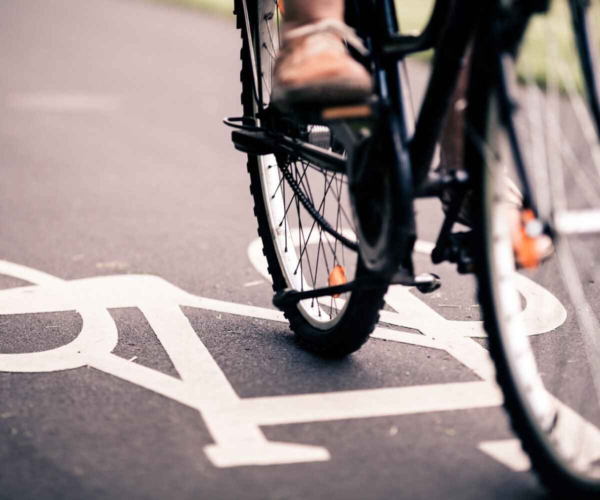 Person riding a bike in a bicycle lane.