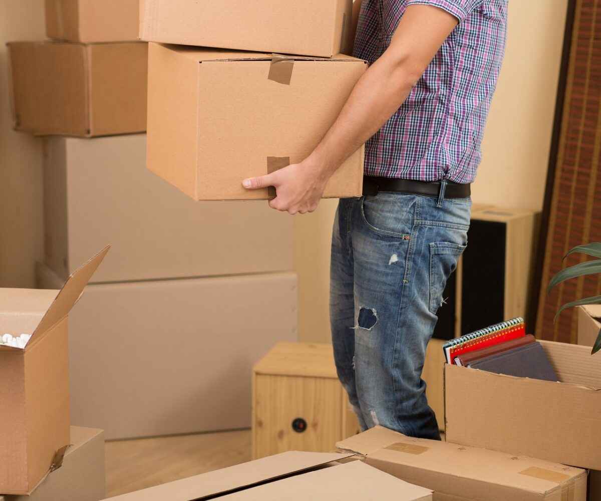 Man carrying moving boxes.