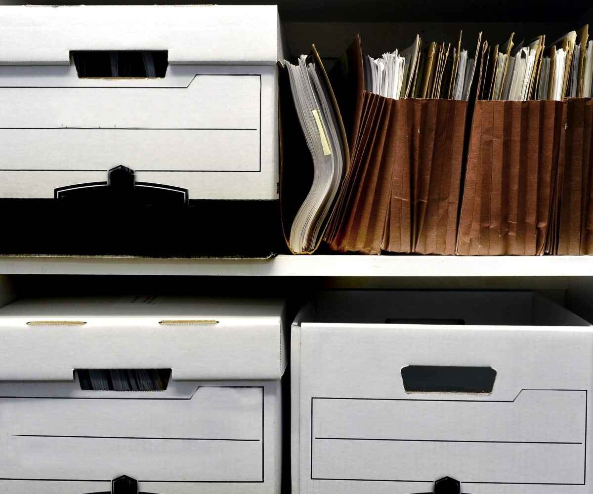 Office shelves full of files and boxes.