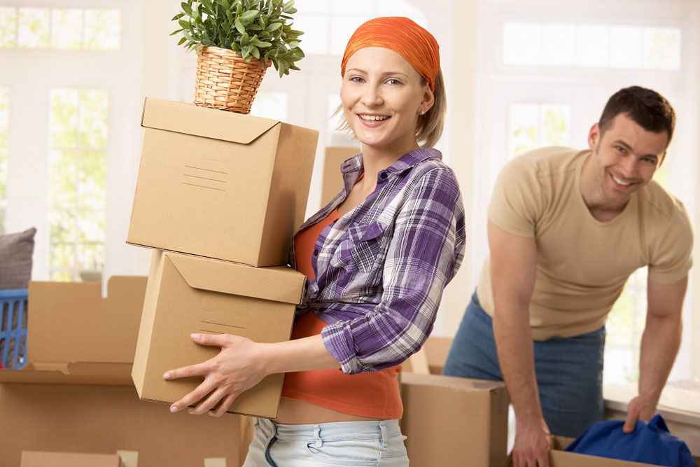 Young couple moving out of their house.