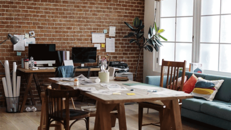 Small business office with supplies scattered around the room.