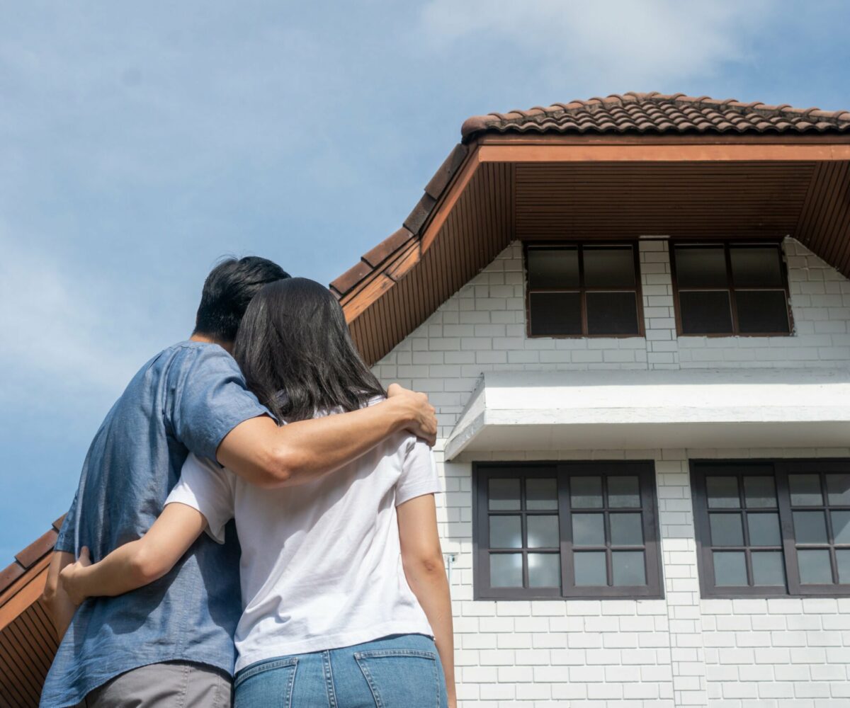 Couple looking at a house.