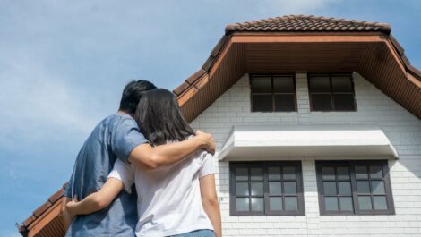 Couple looking at a house.