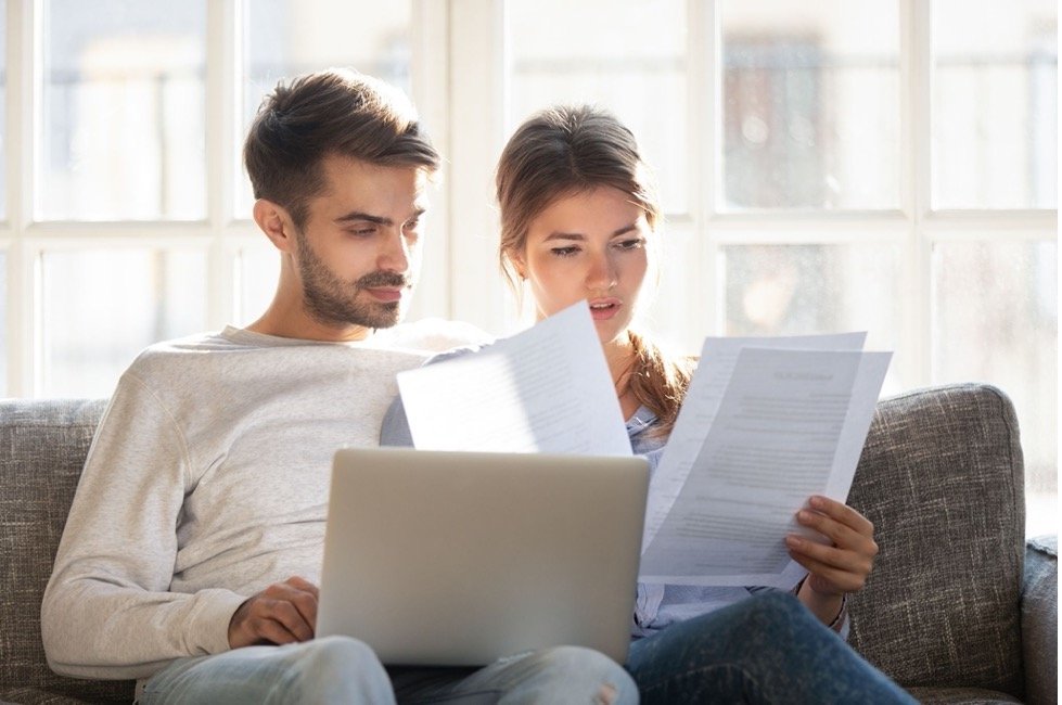 Couple looking at paperwork.